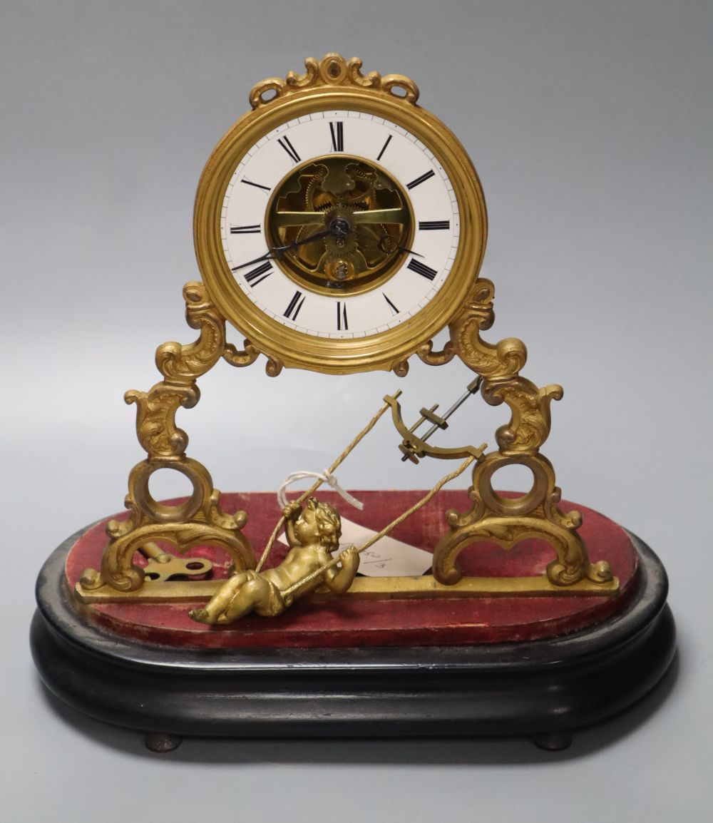 A 19th century French swinging cherub mantel timepiece under glass dome, French movement with exposed escapement, 35cm high
